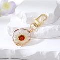 Resin evil eye keychain with white daisy dried flower and gold irregular edge - White Flower