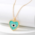 Collar étnico de corazón con colgante de ojo turquesa esmaltado sobre base blanca - Corazón Azul Lago Ojo Turco