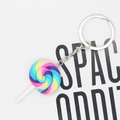 Detailed view of rainbow lollipop keychain with colorful resin swirl and silver metal ring - Blue Pink Yellow And Purple Lollipop
