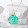 Golden Evil Eye pendant necklace with marbled turquoise resin on white stone blocks - Green Round Eye