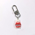 Cute polar bear Christmas keychain with red patterned sweater and metal clasp hanging - Polar Bear in Red Clothes
