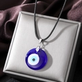 Vintage Turkish evil eye pendant necklace with blue glass on a black braided cord - Sapphire Blue
