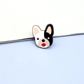 Close-up of a cute French Bulldog enamel pin featuring black and white colors and red tongue - French Bulldog