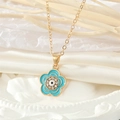 Collar dorado vintage con colgante de flor de ojo azul y brillantes piedras de circonita - Azul lago