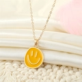 Colorful enamel smiley face necklace with gold alloy chain and bright yellow pendant - Crooked Smiley / Orange