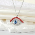 Collar retro Ojo Turco con cristales rojos y circonitas sobre fondo de seda suave - Ojo de Pestaña de Strass Rojo / Plateado