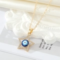 Collana dorata a stella con ciondolo occhio blu e strass brillanti incastonati - Blu