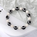Bracelet fait main avec perles œil porte-bonheur noires et blanches et séparateurs en métal - Oeil Noir Style Turquoise Blanche