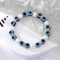 Détail des perles Mauvais Oeil avec perles d'imitation et intercalaires en cristal doré - Oeil Bleu Avec 1 Perle