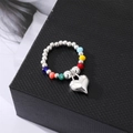 Colorful beaded elastic ring with silver round beads and a polished heart charm pendant - Heart Ring