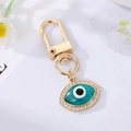 Golden Evil Eye keychain with blue resin center and sparkling white crystal rhinestones - Green Eye with Rhinestones