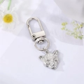 Macro shot of silver alloy leopard head pendant with detailed texture and lobster clasp - Silver Leopard Head