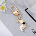 Creative gold moon astronaut keychain with sitting spaceman and polished metal ring - Astronaut Holding Moon