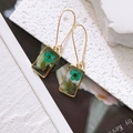 Rectangle gold-framed earrings featuring transparent resin with green dried flowers and foil - Green Flower (With Pearl)