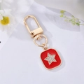 Star-patterned red drip oil pendant keychain with gold plating and sparkling crystals - Red Enamel Star