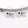 Detailed view of cute game controller earrings with colorful buttons on white resin - White