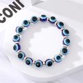 Bracelet élastique fait main avec perles mauvais œil bleues et perles dorées en métal - Perles Rondes Oeil Bleu