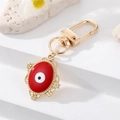 Golden alloy evil eye keychain with red enamel pendant and vintage flower engraving - Oval Red Enamel (K200)