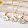 Modisches Evil Eye Schmuckset mit goldenem Stern Halskette und passenden Creolen - Set / Blau