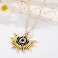 Golden sunflower eye pendant necklace with crystals on white background - Black Rhinestone Radiant Sun Style