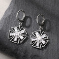 Elegant silver starburst earrings with sparkling diamonds on natural grey stone surface - Pentagon Hoop