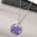 Handmade clear resin necklace with purple dried flower and silver foil on a silver chain - Purple