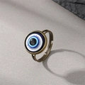 Vintage evil eye ring with blue glitters on dark background with stone accent - One Eye Ring