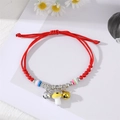 Detail of red braided bracelet with silver bells and cute yellow mushroom pendant charms - Gold Silver Bell Yellow Mushroom