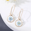Handmade resin round hoop earrings with blue dried flowers and gold hooks for women - Blue