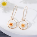Handmade round dried flower resin drop earrings with gold-finished hooks for elegant women - Orange
