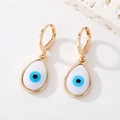 Golden hook earrings featuring evil eye teardrop pendants on a minimalist white background - Teardrop Evil Eye