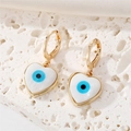 Vintage gold heart earrings with seashell evil eye inlay on stone background - Heart Evil Eye