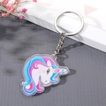 Cute acrylic unicorn keychain with colorful double-sided print and metal ring on gray surface - Blue Pink Mane Pony Style