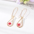Handmade teardrop resin earrings with red dried flowers and gold leaf foil accents - Red