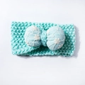 Detail of mint blue knitted headband featuring an embroidered floral bow for kids - Mint Green