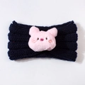 Detail of navy blue knitted baby headband with a cute pink plush pig embroidery - Navy Blue