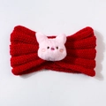 Detail of red cable-knit baby headband with cute pink plush piglet cartoon decor - Red