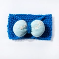 Close-up of knit texture and light blue bow with white flower embroidery on baby headband - Blue