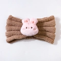 Detailed view of brown chunky knit baby headband featuring a cute pink plush bunny accent - Coffee