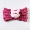 Detail of pink knitted baby headband featuring a plush pig decoration for winter warmth - Dust Rose