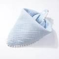 Detail of light blue cotton gauze baby bib with white pom-pom trim and snap closure - Blue