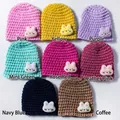 Detail of multi-color knitted baby hats with cute 3D bunny decor and thick knit texture - 8-Color Mix