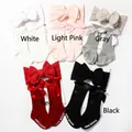 Detailed flat lay of baby socks and headband set with satin bows in five assorted colors - Mixed Color Series