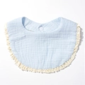 Close-up of baby bib featuring soft blue cotton gauze fabric and white lace trim detail - Blue