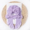 Lavender knitted baby hat and socks set with bow ties on a natural straw mat - Purple