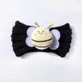 Detail of a black knitted baby headband with a cute plush bee ornament and clear texture - Black