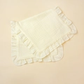 Detail view of double-layered cotton muslin baby burp cloths with elegant ruffled edges - Beige