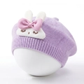 Close-up of baby knit beret in light purple featuring cute plush bunny and bow detail - Purple