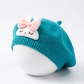 Detailed knit texture of a cyan baby beret with a cute white rabbit embroidery patch - Royal Blue