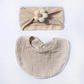 Detail of baby bib and flower headband set in soft beige cotton gauze and knit texture - Light Coffee